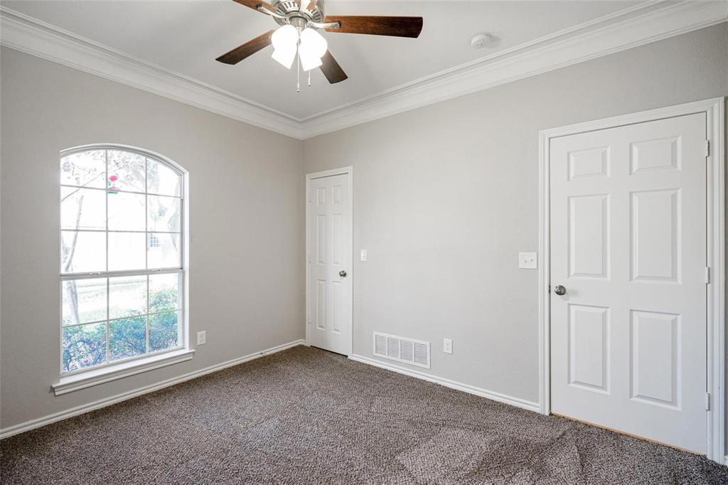 1006 Merribrook Lane Allen, TX 75002 - Photo 22 of 29 an empty room with windows and fan