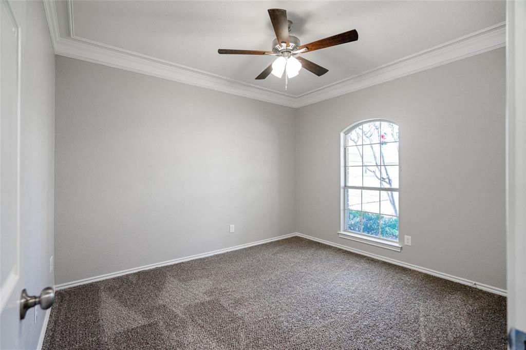 1006 Merribrook Lane Allen, TX 75002 - Photo 23 of 29 an empty room with a window and a fan