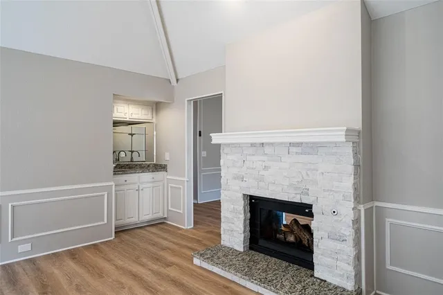 a room with fireplace and wooden floor