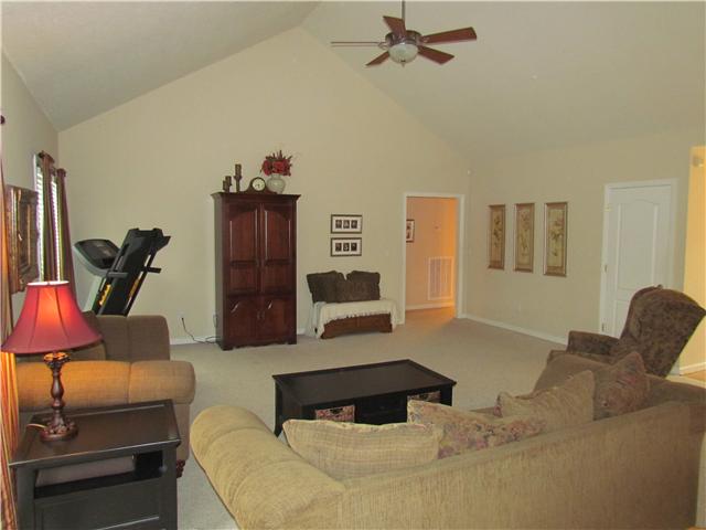 52 Spring Creek Road Lebanon, TN 37087 - Photo 3 of 17 Spacious living room with a coat closet and a dimmer light on the ceiling fan.