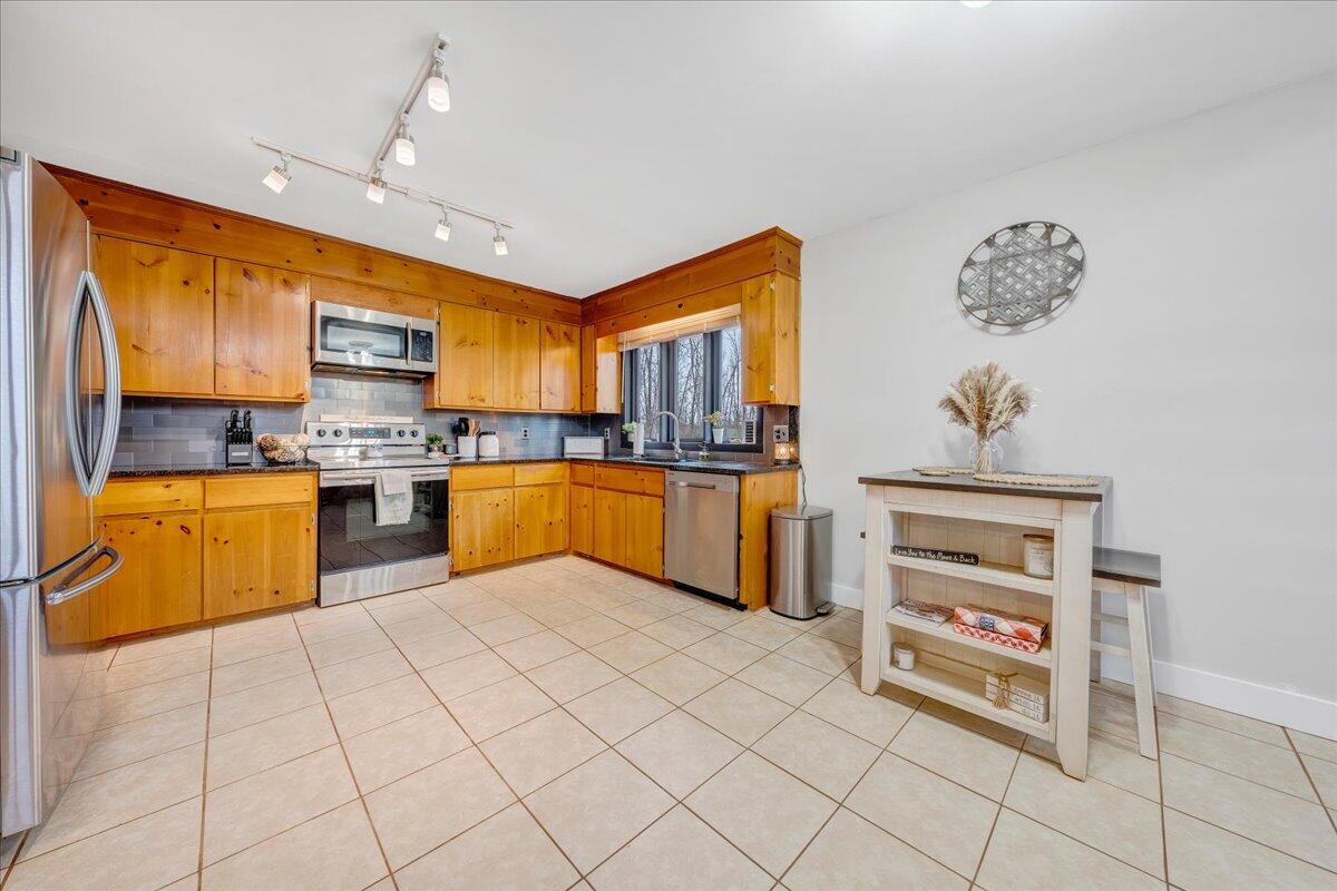 2800 Old Ferrum Road Ferrum, VA 24088 - Photo 13 of 58 a kitchen with a cabinets a sink and a stove top oven