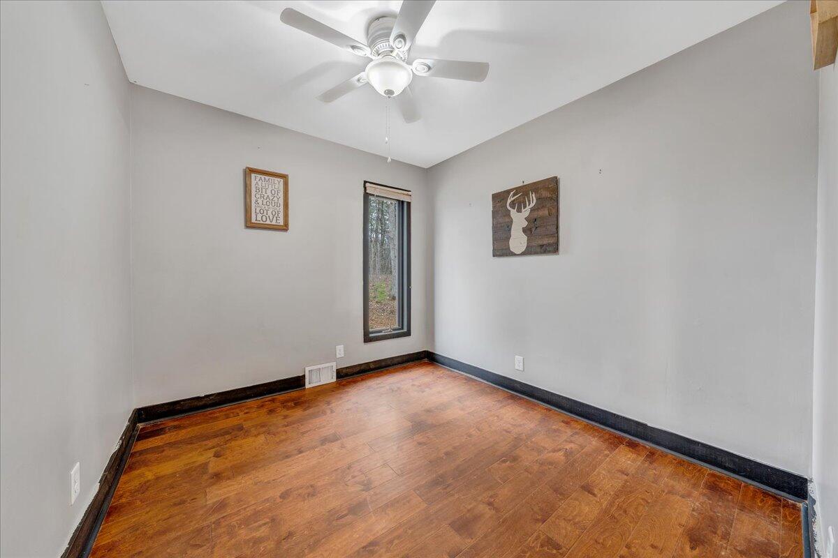2800 Old Ferrum Road Ferrum, VA 24088 - Photo 21 of 58 an empty room with windows and fan