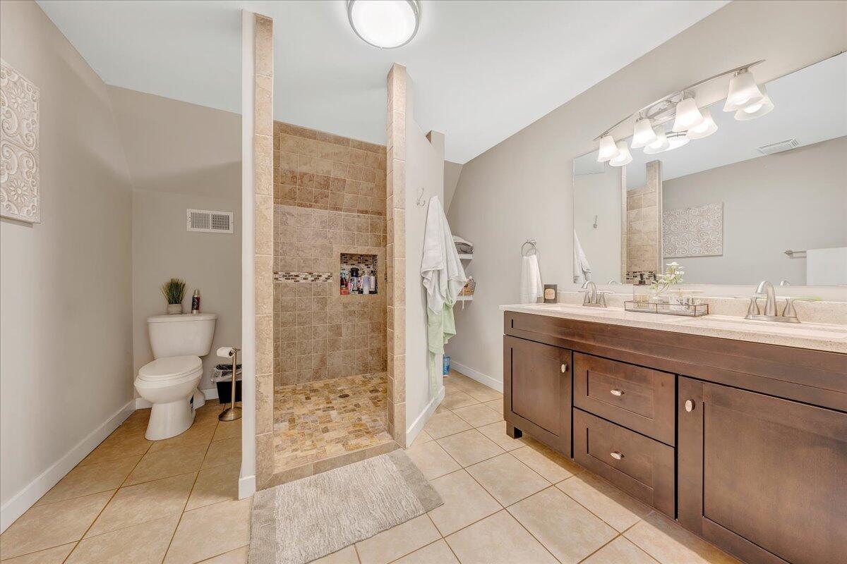 2800 Old Ferrum Road Ferrum, VA 24088 - Photo 33 of 58 a bathroom with a double vanity sink toilet and shower
