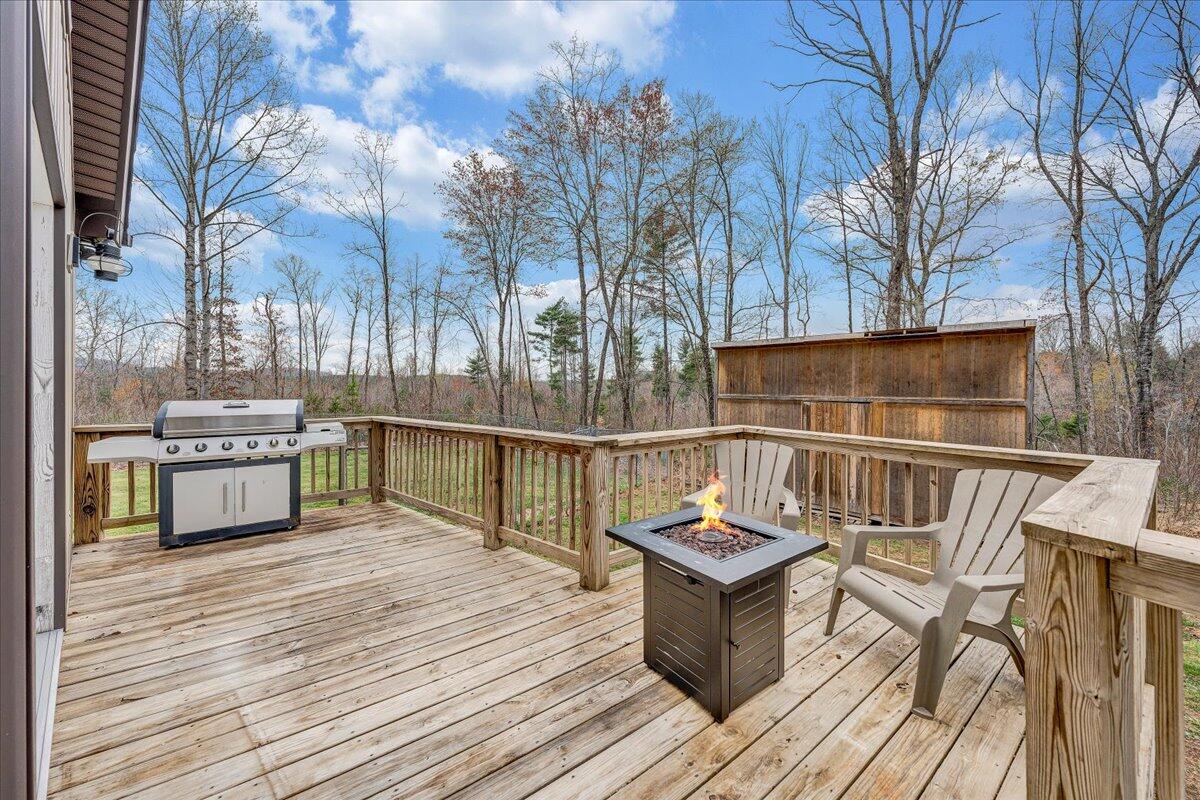 2800 Old Ferrum Road Ferrum, VA 24088 - Photo 35 of 58 a view of a balcony with wooden floor and outdoor seating