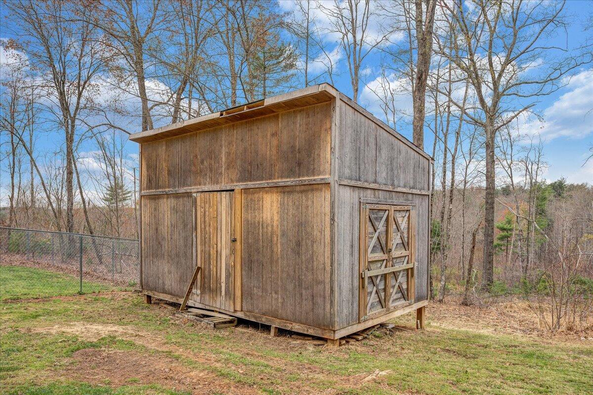2800 Old Ferrum Road Ferrum, VA 24088 - Photo 53 of 58 a backyard of a house with large trees and wooden fence