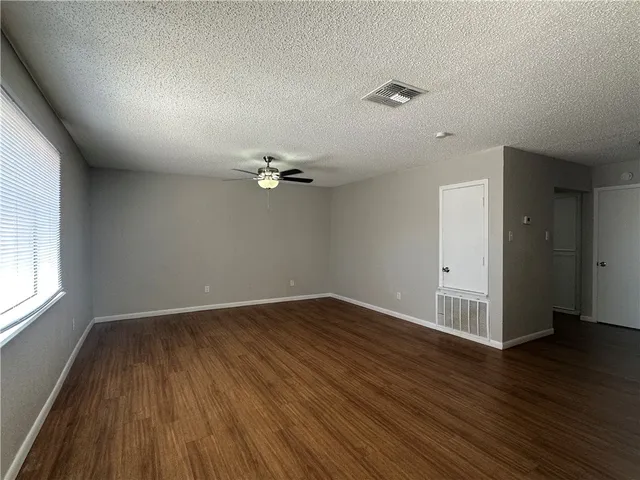 a view of wooden floor in an empty room