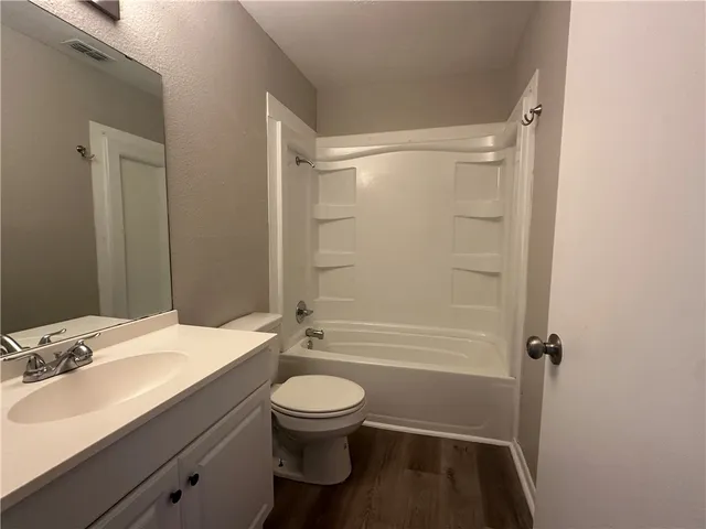 a bathroom with a toilet a sink and a bathtub