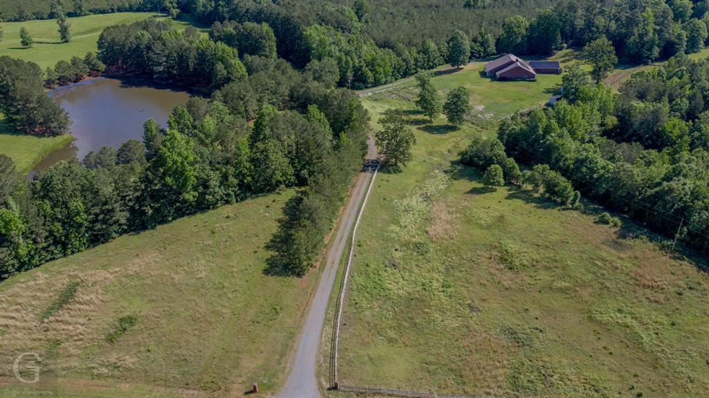 1212 WPA Road Homer, LA 71040 - Photo 31 of 35 Aerial overview of property's location featuring a large body of water, a forest, and rural landscape