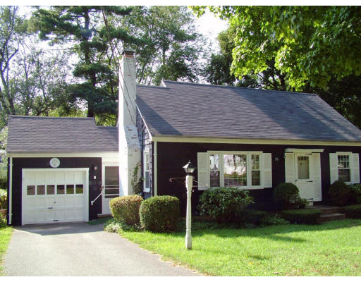 76 Pilgrim Road Springfield, MA 01118 - Photo 1 of 1 a front view of a house with a garden and plants