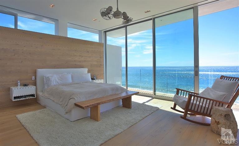 25236 Malibu Road Malibu, CA 90265 - Photo 18 of 33 a bedroom with a bed and large window