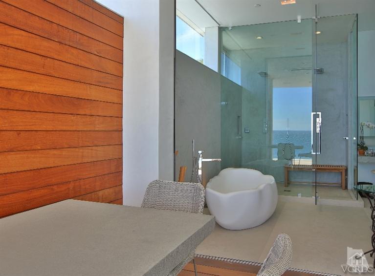 25236 Malibu Road Malibu, CA 90265 - Photo 20 of 33 a bathroom with a sink and a mirror