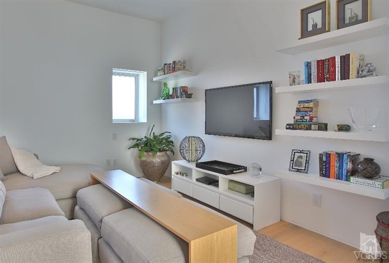 25236 Malibu Road Malibu, CA 90265 - Photo 23 of 33 a living room with furniture and a book shelf