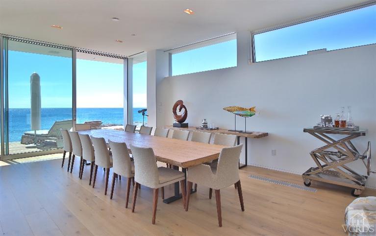 25236 Malibu Road Malibu, CA 90265 - Photo 8 of 33 a view of a dining room with furniture window and wooden floor