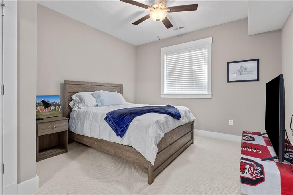 2010 Cherry Road Gibsonia, PA 15044 - Photo 18 of 25 a spacious bedroom with a bed and a flat screen tv