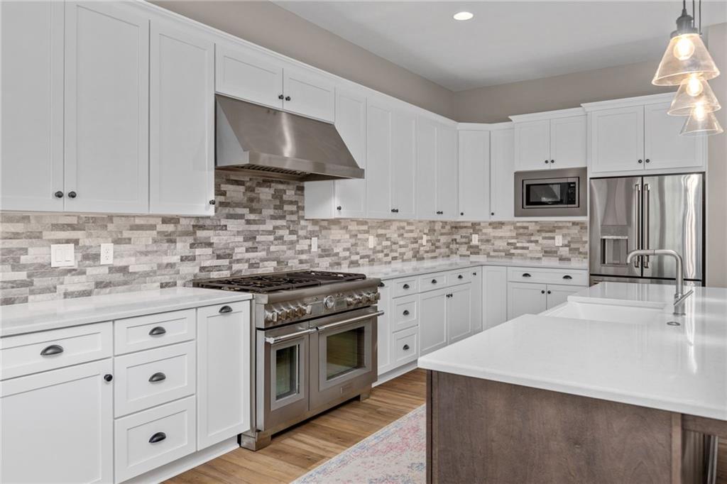 2010 Cherry Road Gibsonia, PA 15044 - Photo 6 of 25 a kitchen with white cabinets sink and stainless steel appliances
