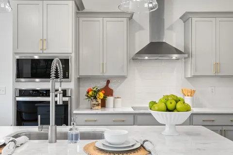 a kitchen with a sink and a stove