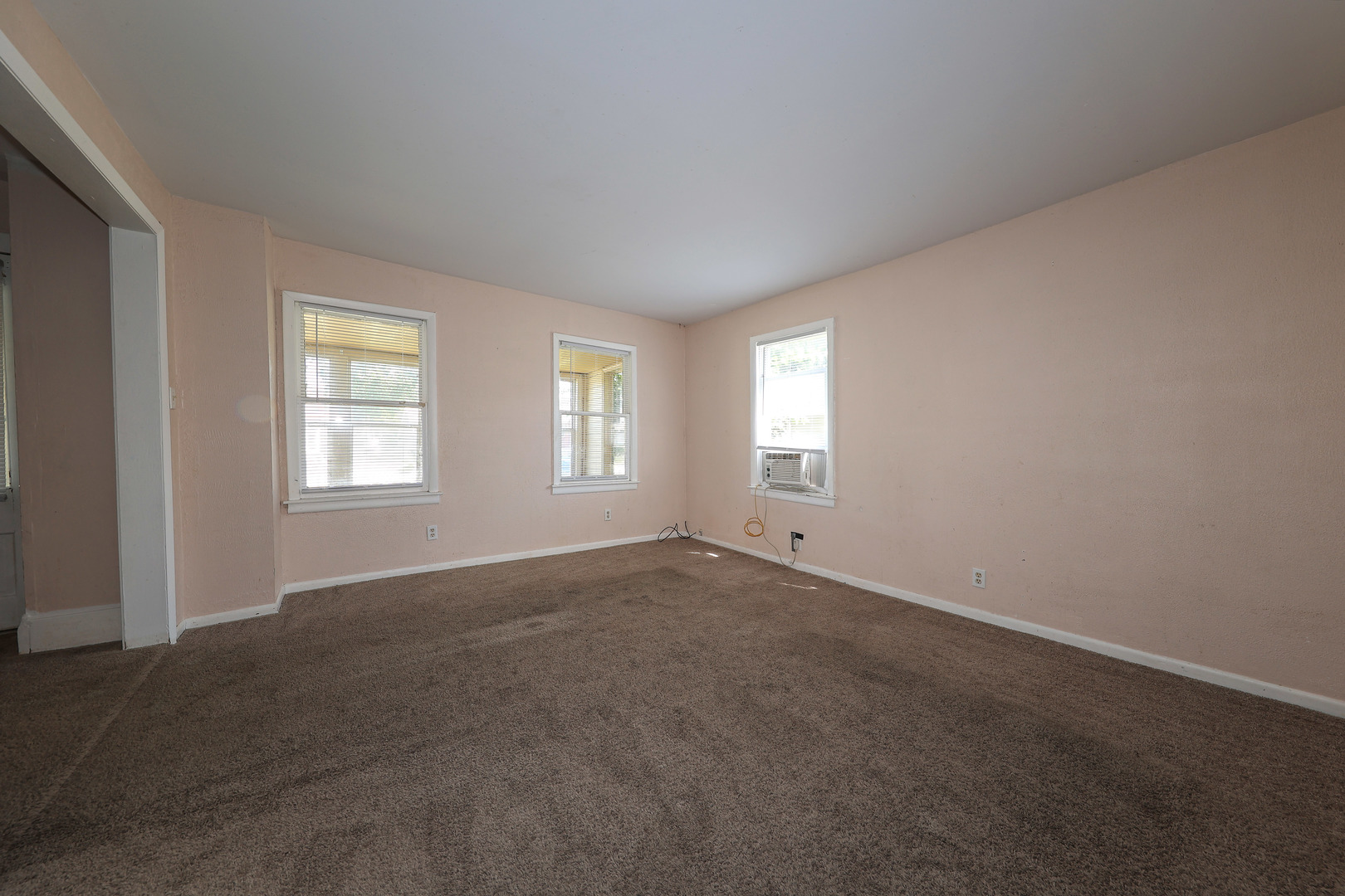 115 North Main Street Seneca, IL 61360 - Photo 11 of 17 a view of an empty room with windows