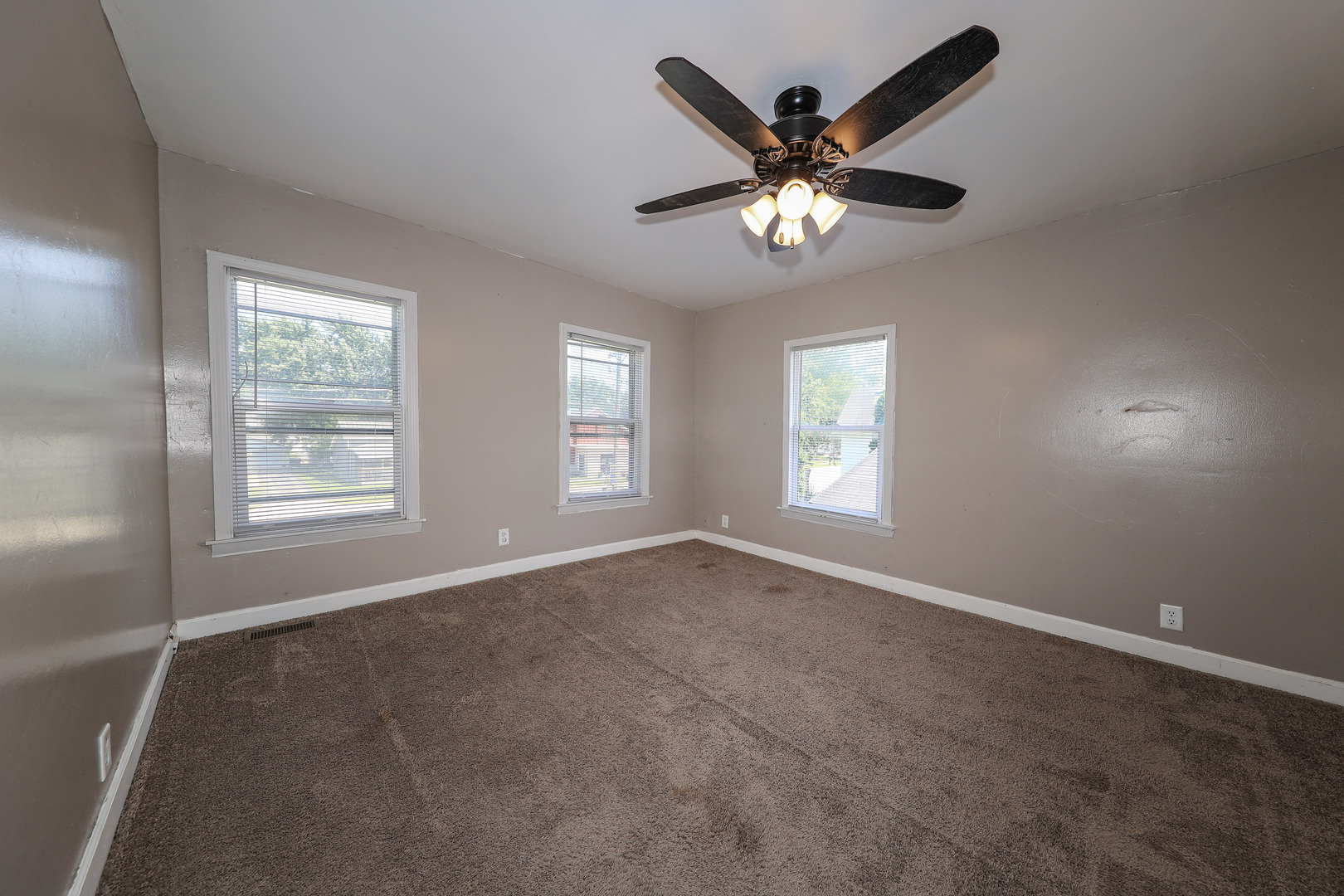115 North Main Street Seneca, IL 61360 - Photo 13 of 17 a view of an empty room with a window