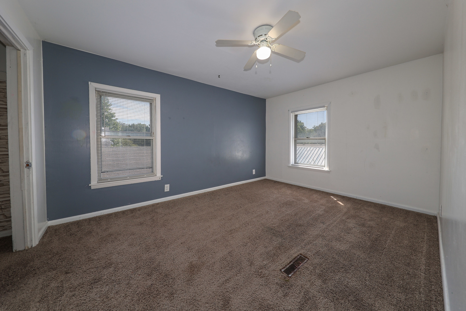 115 North Main Street Seneca, IL 61360 - Photo 14 of 17 a view of empty room with windows