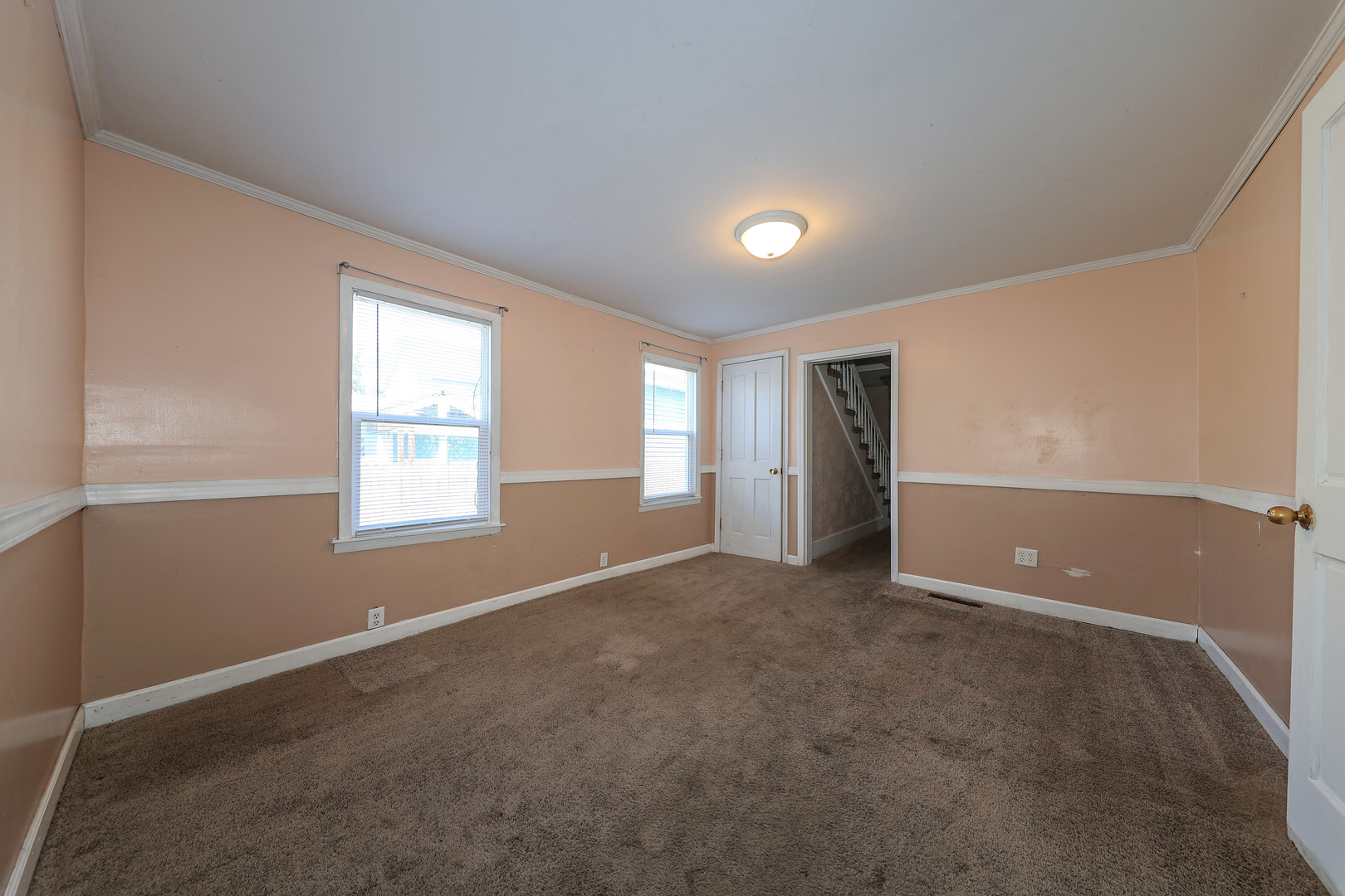 115 North Main Street Seneca, IL 61360 - Photo 6 of 17 an empty room with windows and closet