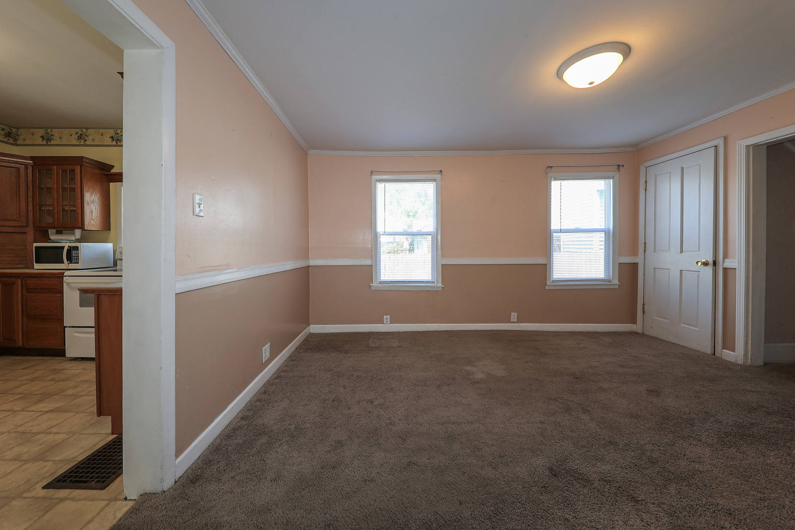 115 North Main Street Seneca, IL 61360 - Photo 7 of 17 an empty room with windows and entrance