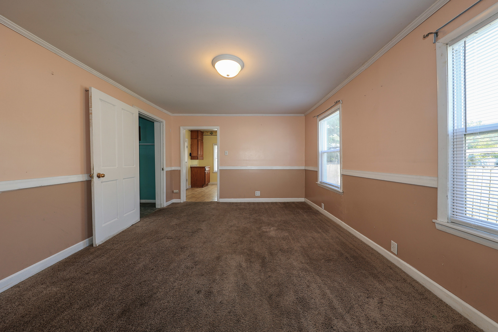 115 North Main Street Seneca, IL 61360 - Photo 8 of 17 an empty room with windows and closet