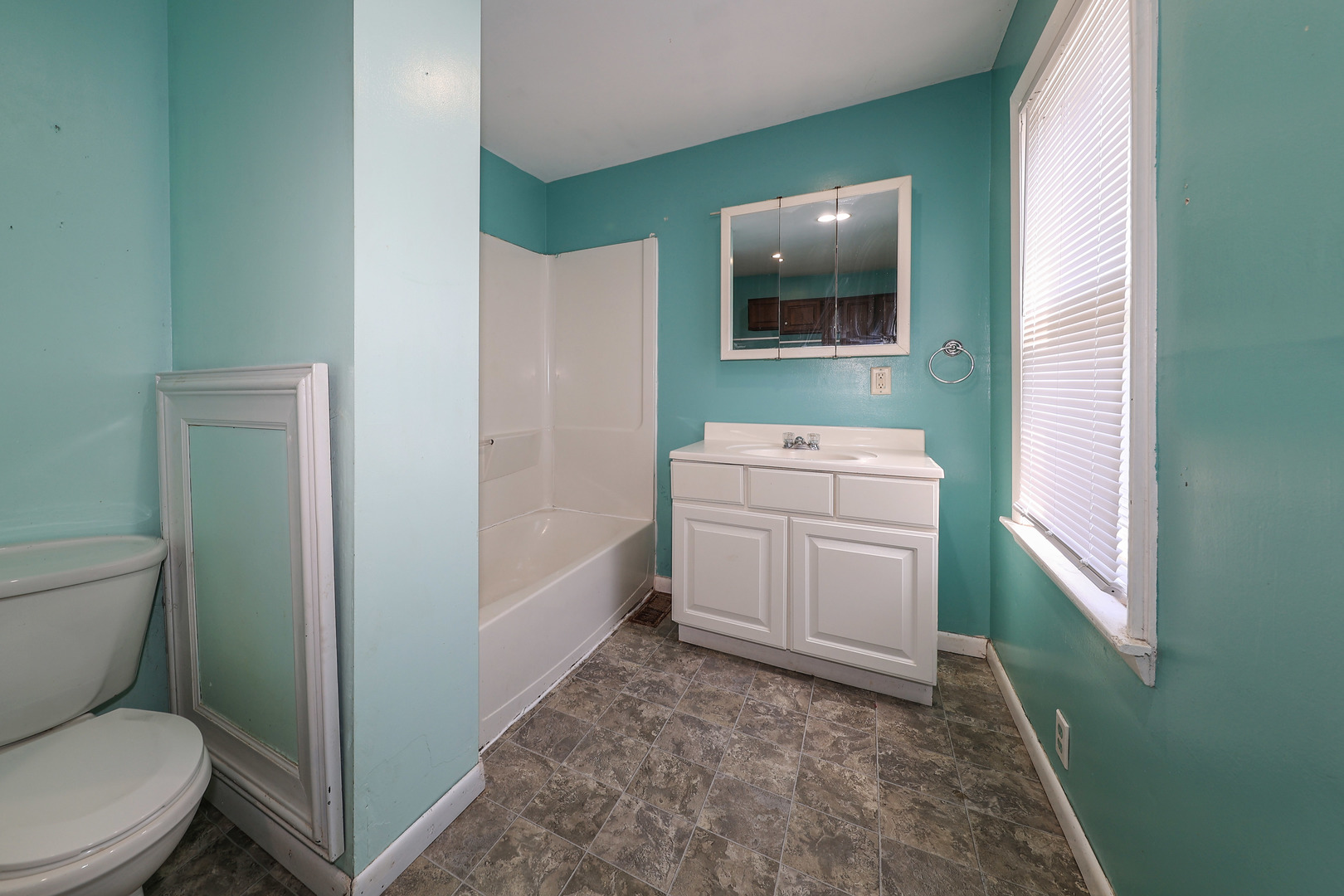 115 North Main Street Seneca, IL 61360 - Photo 9 of 17 a bathroom with a toilet sink and mirror