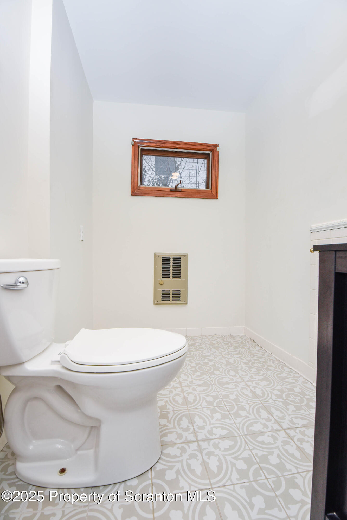 917 Taylor Avenue Scranton, PA 18510 - Photo 21 of 43 a white toilet sitting next to a bathroom sink
