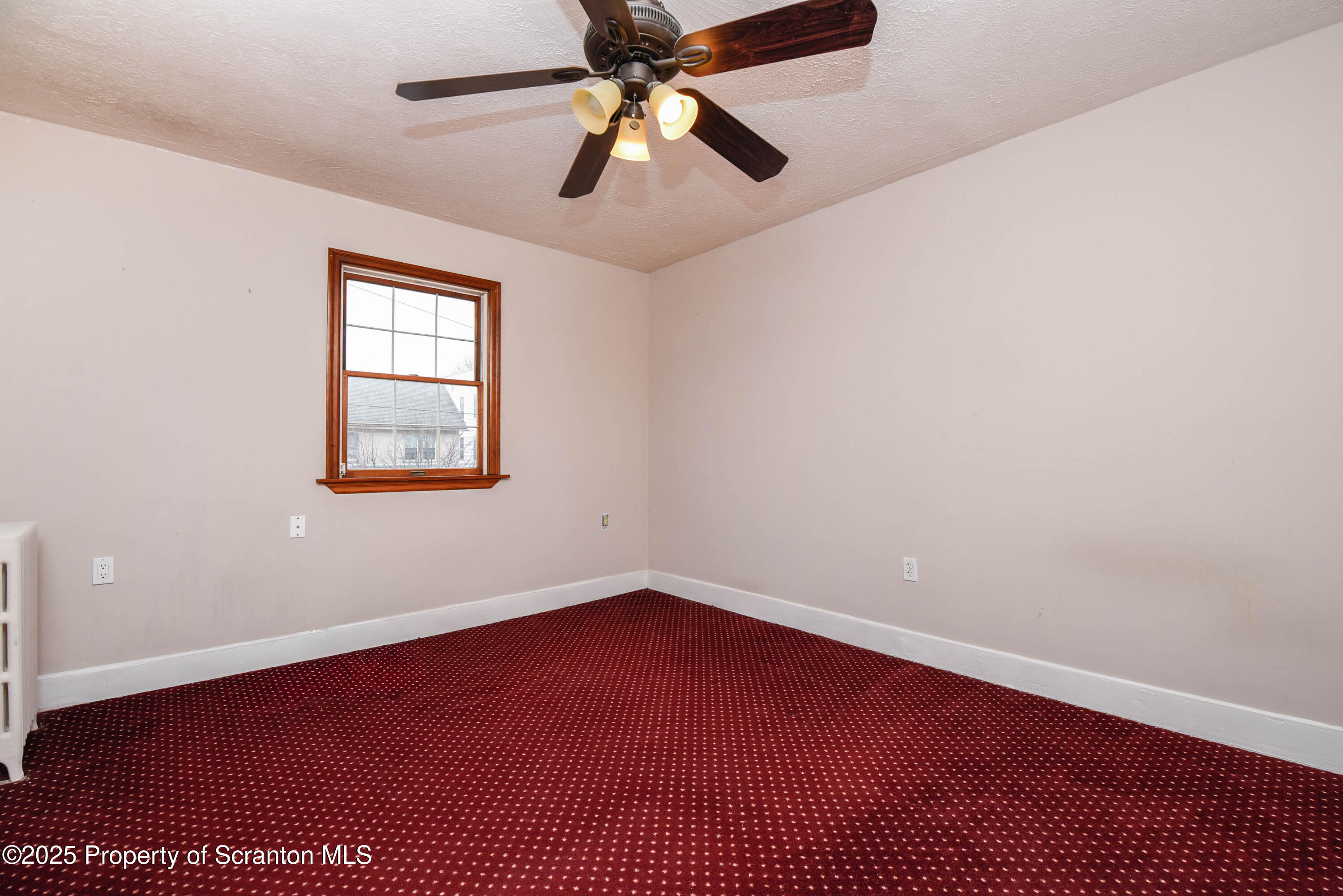 917 Taylor Avenue Scranton, PA 18510 - Photo 26 of 43 an empty room with a window and a fan
