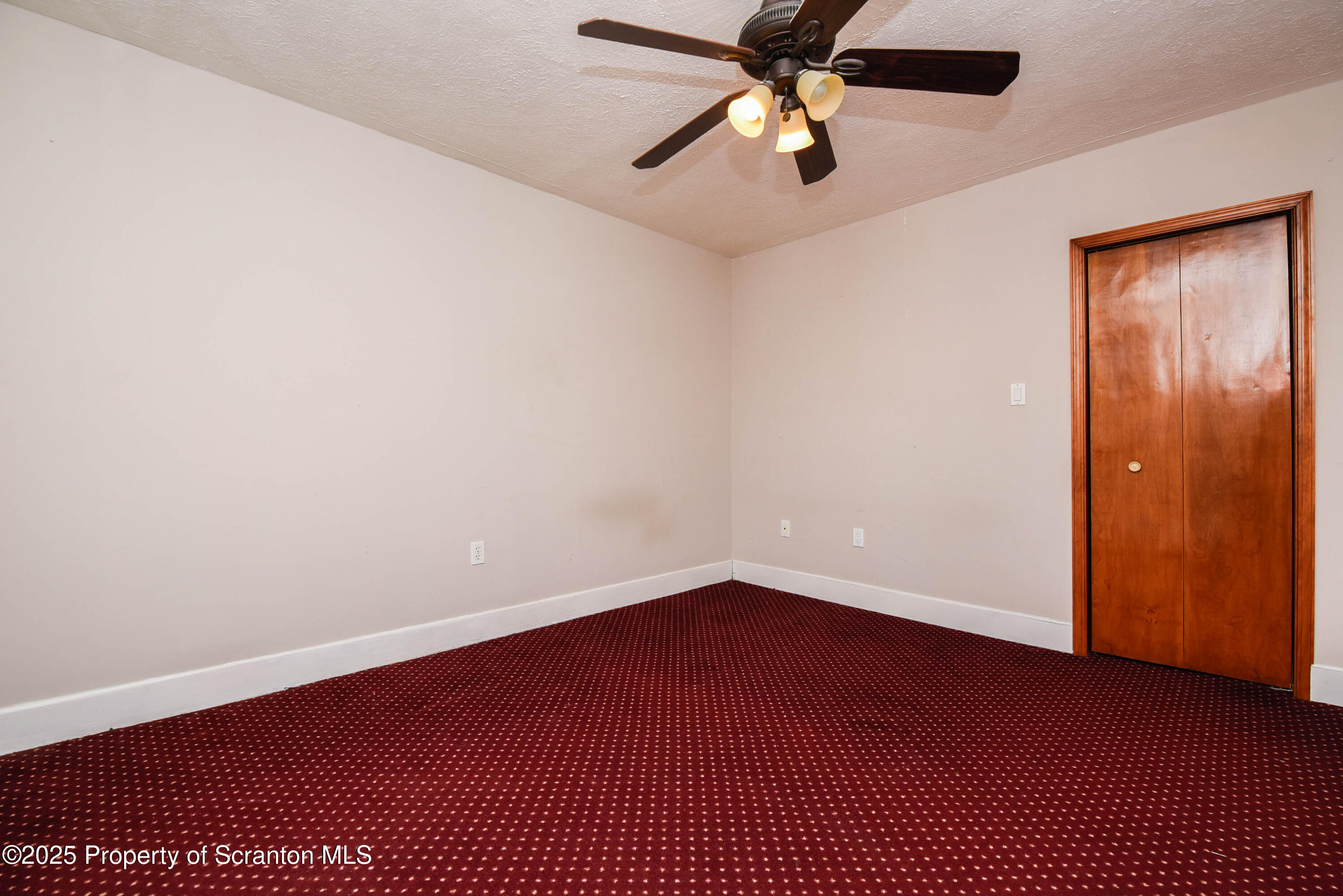 917 Taylor Avenue Scranton, PA 18510 - Photo 28 of 44 an empty room with a window and a fan