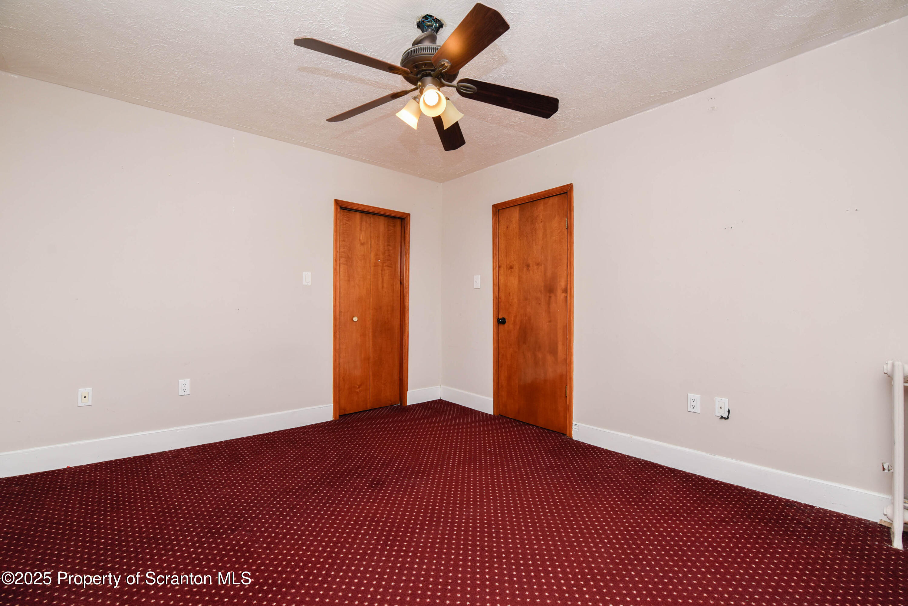 917 Taylor Avenue Scranton, PA 18510 - Photo 28 of 43 an empty room with closet and fan