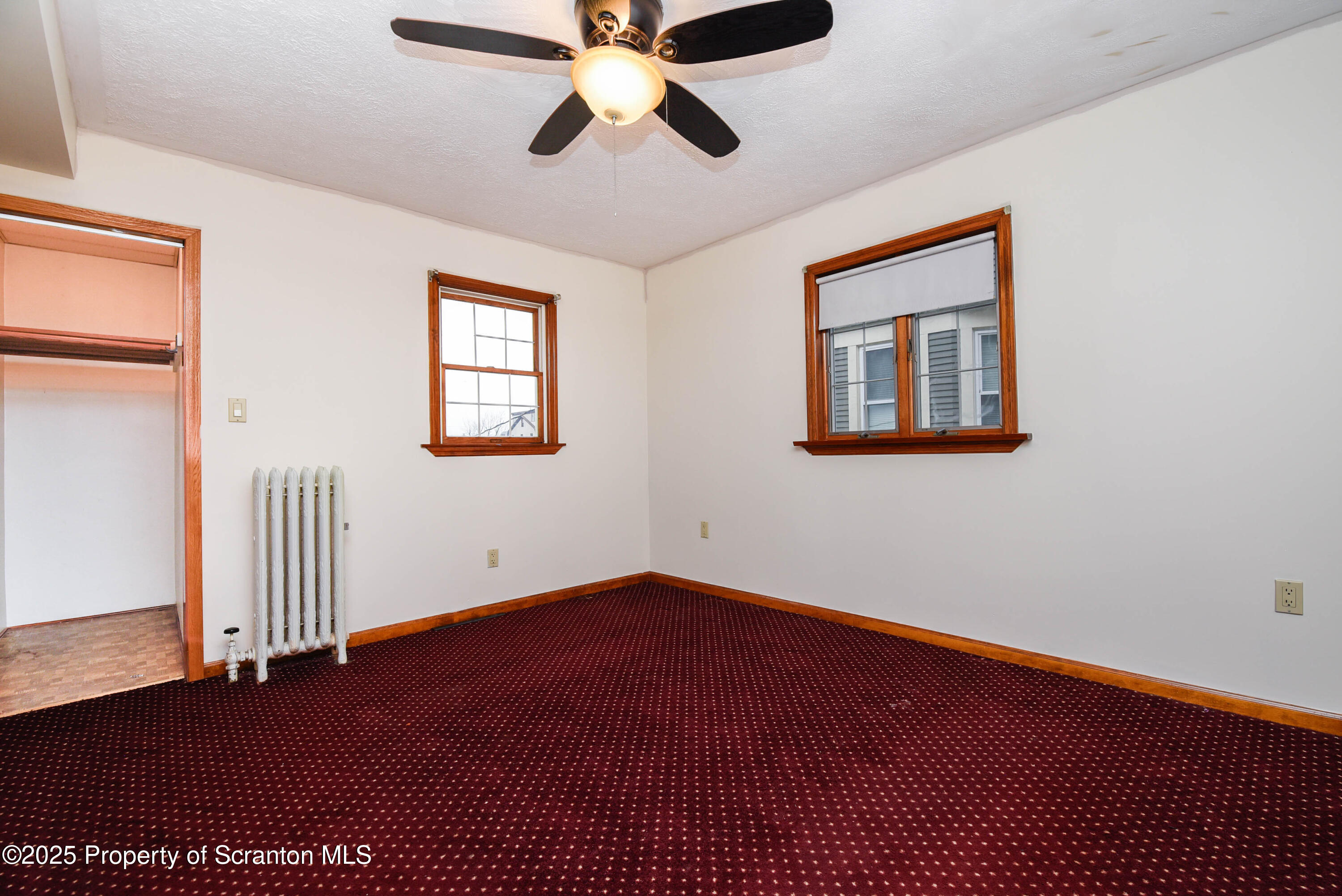 917 Taylor Avenue Scranton, PA 18510 - Photo 29 of 44 a view of an empty room with wooden floor and a window