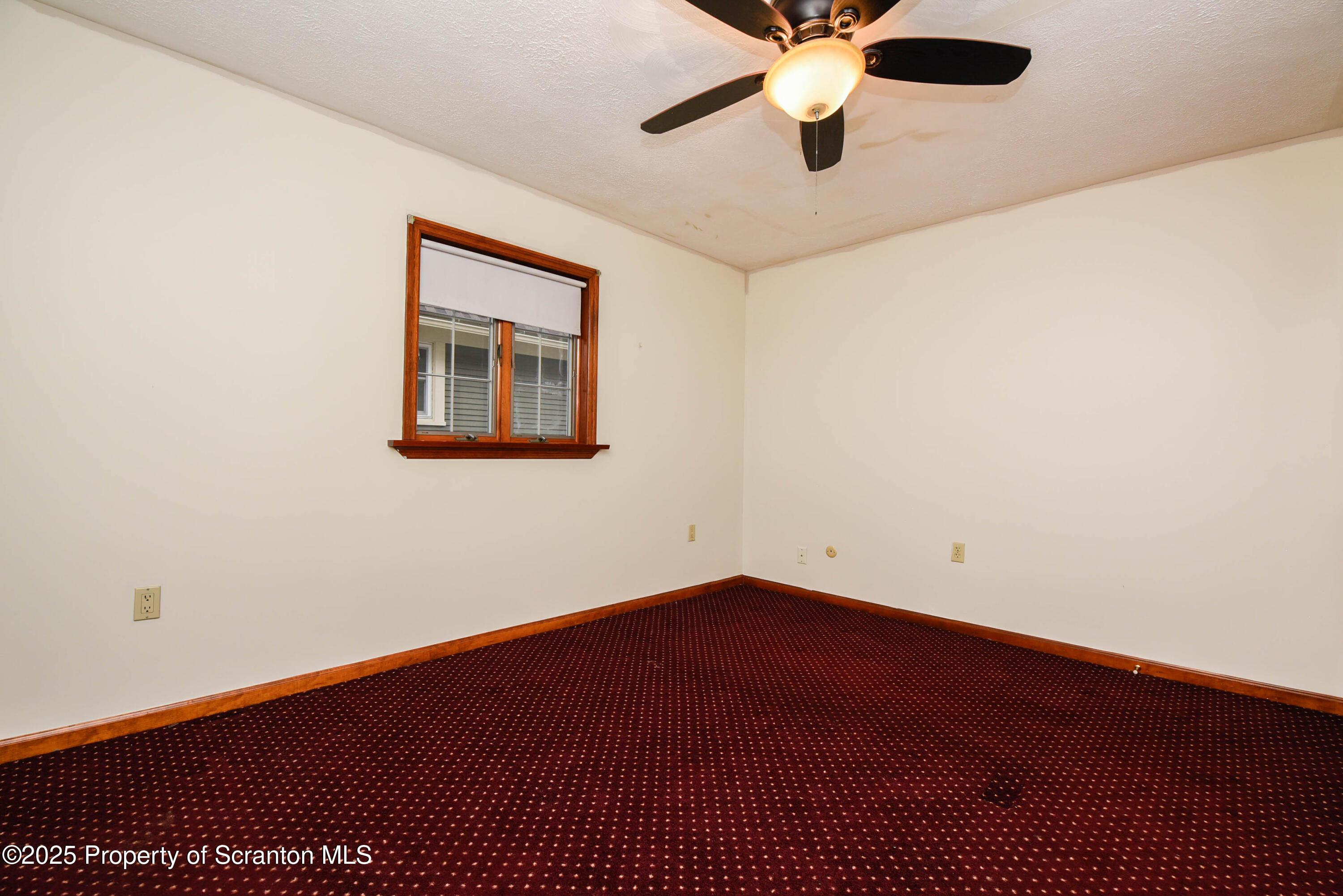 917 Taylor Avenue Scranton, PA 18510 - Photo 33 of 43 an empty room with a window and a fan