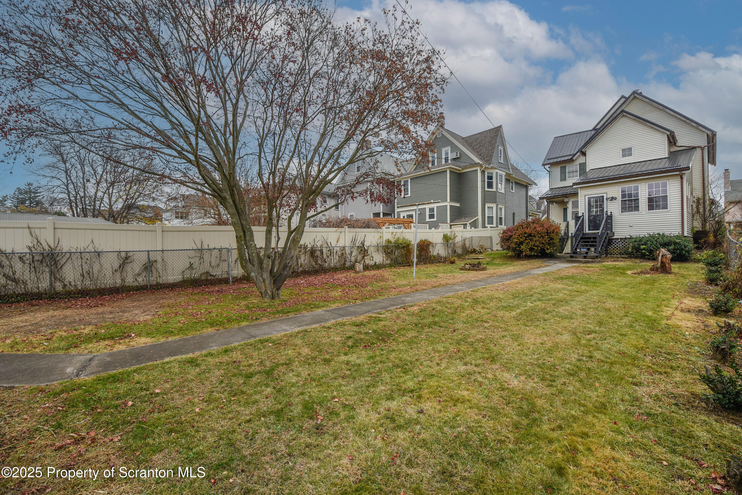 917 Taylor Avenue Scranton, PA 18510 - Photo 41 of 44 a front view of residential houses with yard and trees