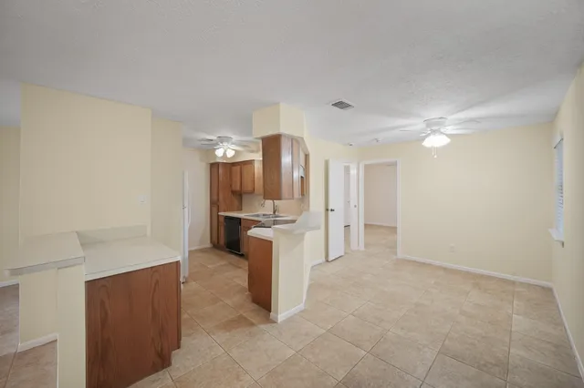 a view of a kitchen with a sink