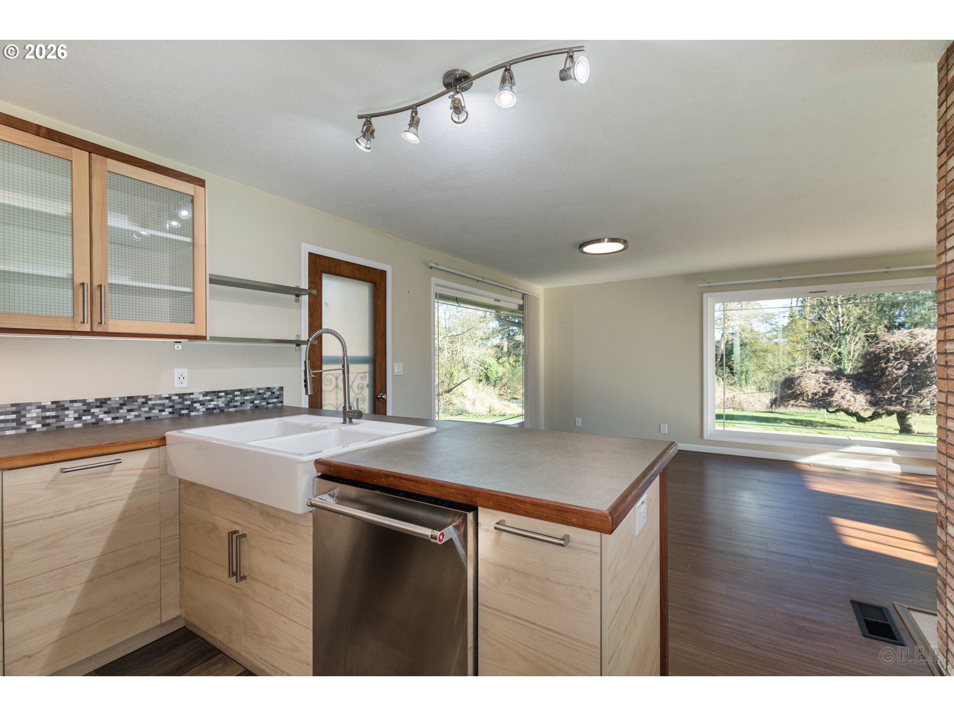 154 Michael Avenue St. Helens, OR 97051 - Photo 11 of 28 a kitchen with a table chairs and wooden floor