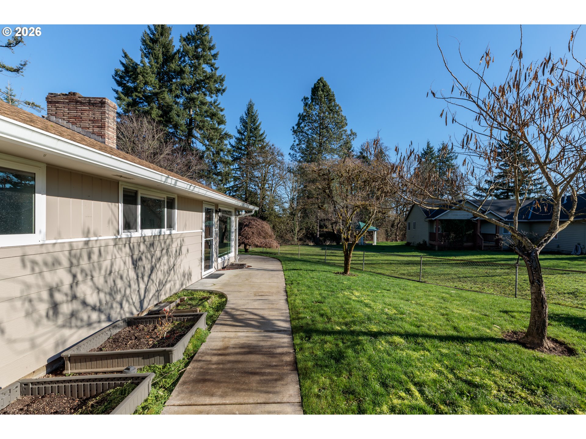154 Michael Avenue St. Helens, OR 97051 - Photo 2 of 28 a view of a yard with a house in the background