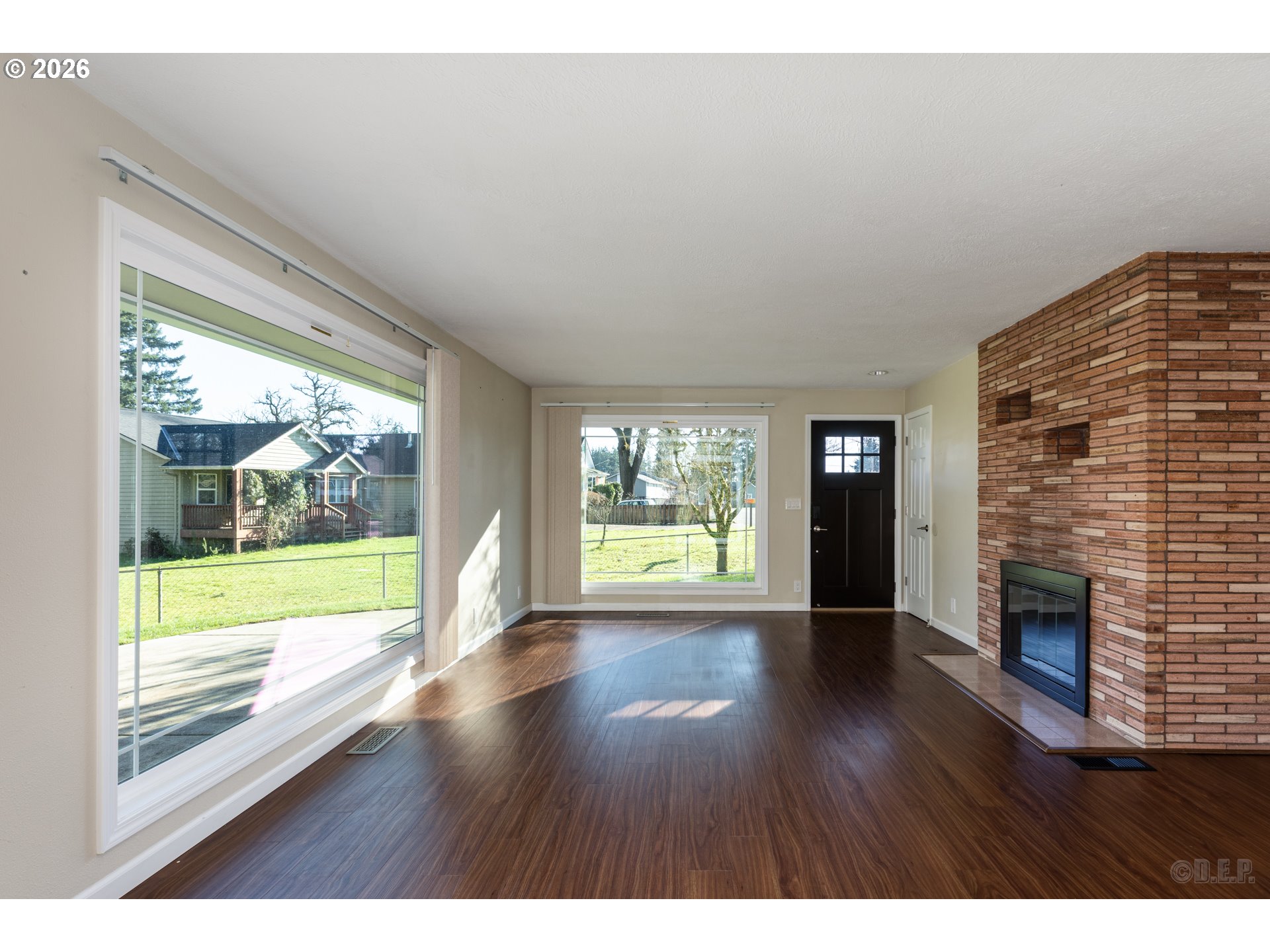 154 Michael Avenue St. Helens, OR 97051 - Photo 4 of 28 a view of an empty room with wooden floor and a fireplace