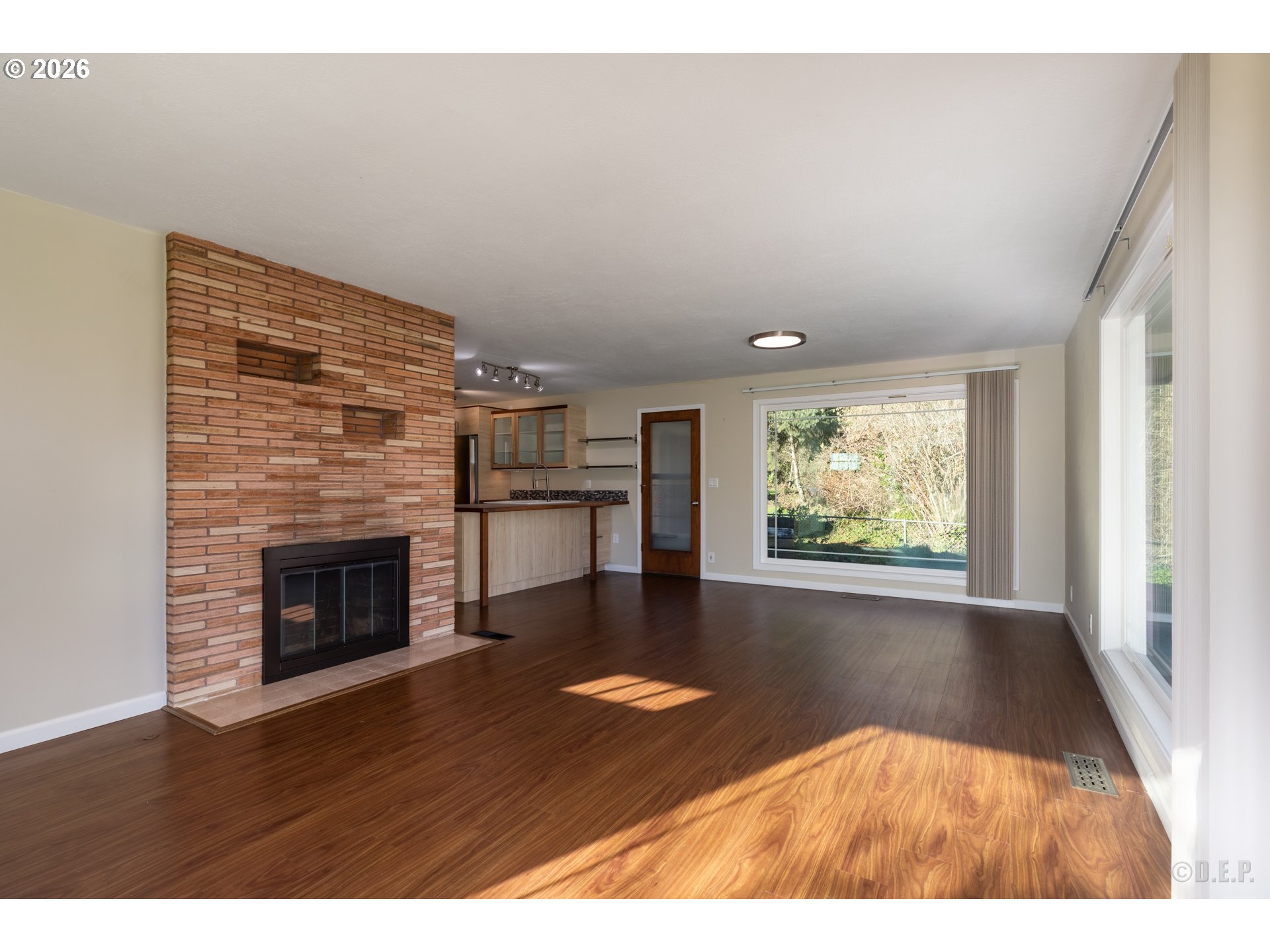 154 Michael Avenue St. Helens, OR 97051 - Photo 5 of 28 a view of an empty room with wooden floor and a window