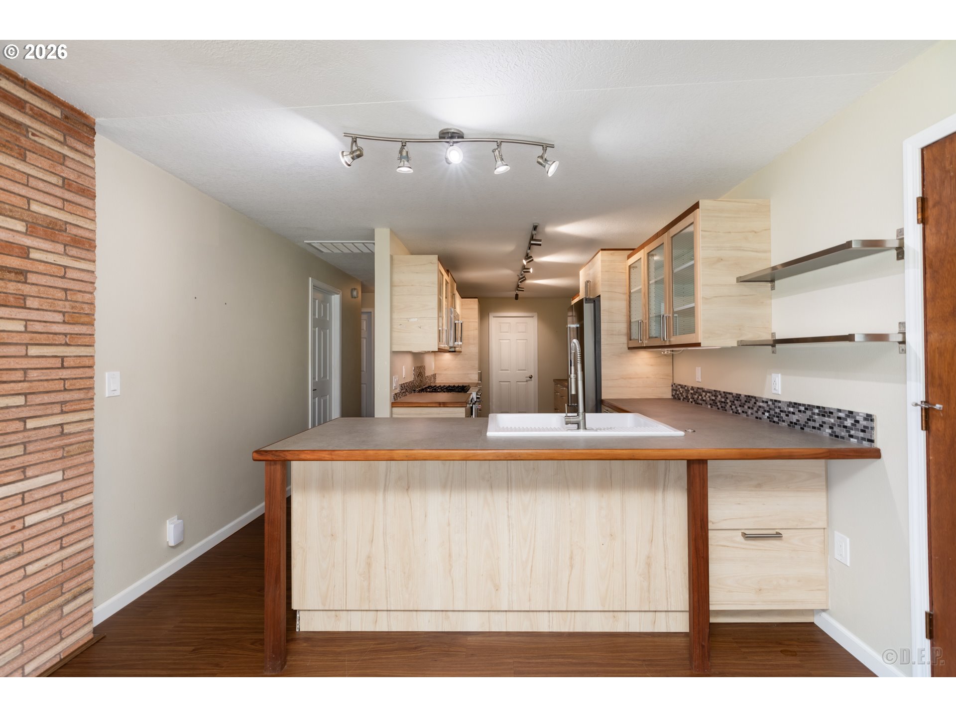 154 Michael Avenue St. Helens, OR 97051 - Photo 6 of 28 a view of kitchen with cabinets and wooden floor