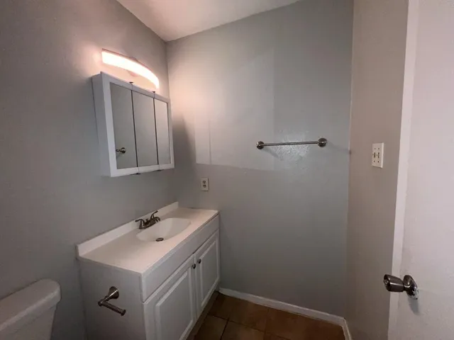 a bathroom with a sink and mirror