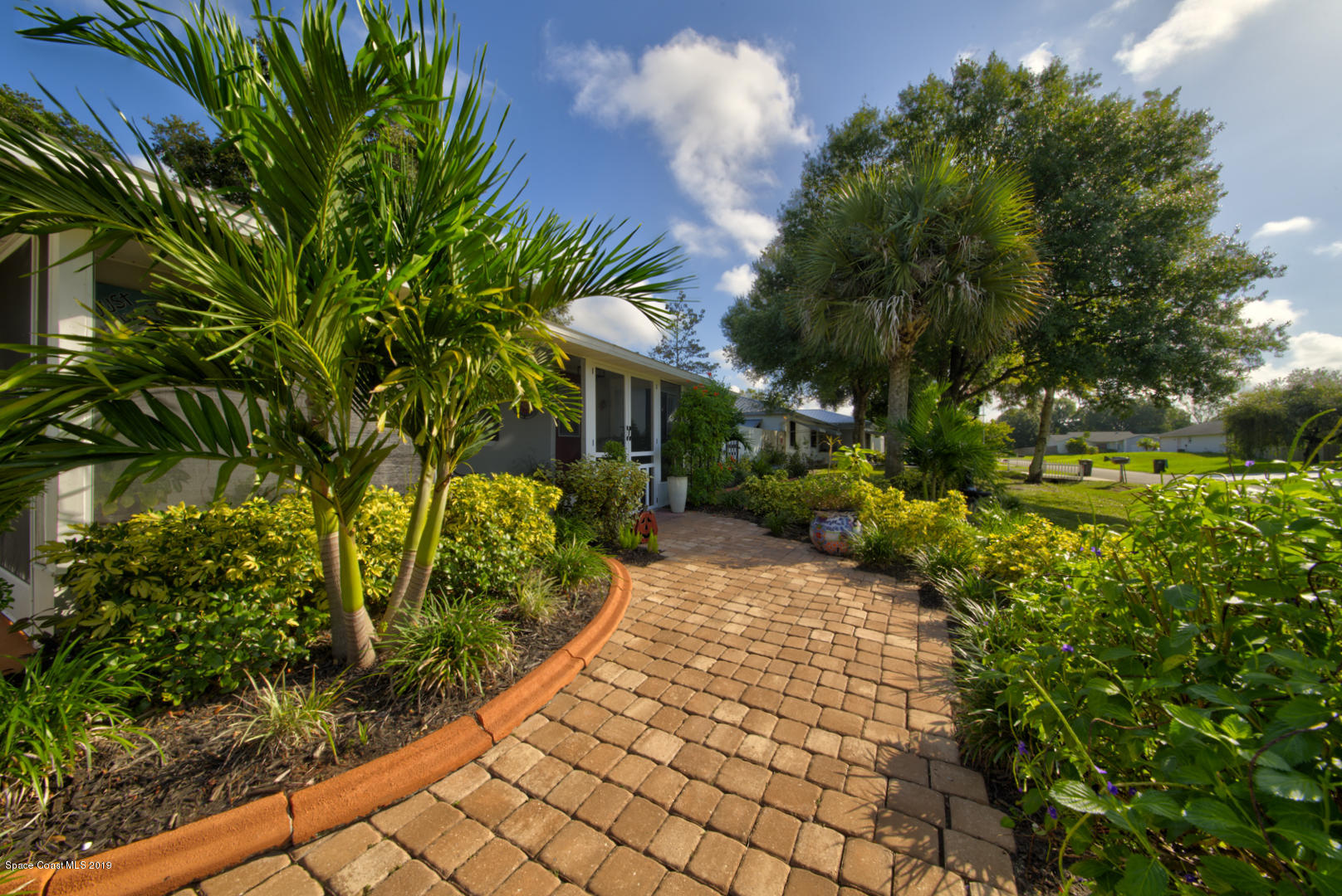 829 Furth Road Northwest Palm Bay, FL 32907 - Photo 3 of 42 walkway to front porch