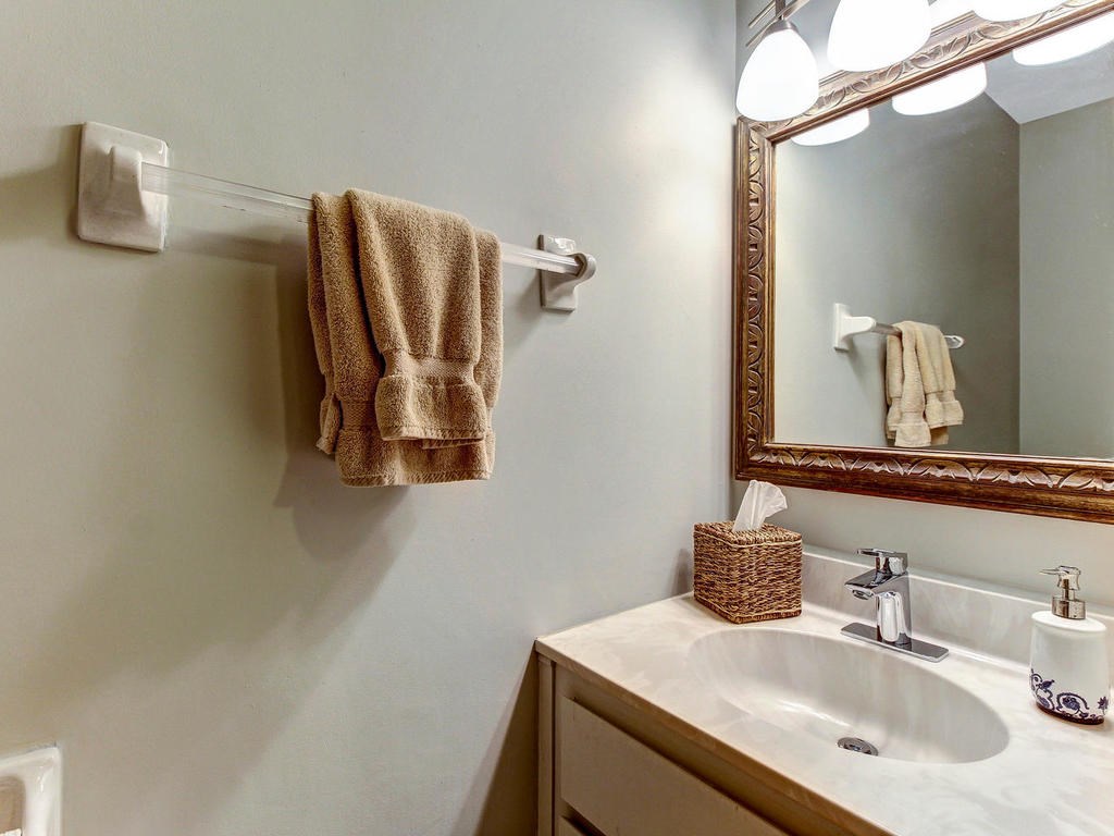 97584 Pirates Point Road Yulee, FL 32097 - Photo 29 of 35 a bathroom with a sink and mirror
