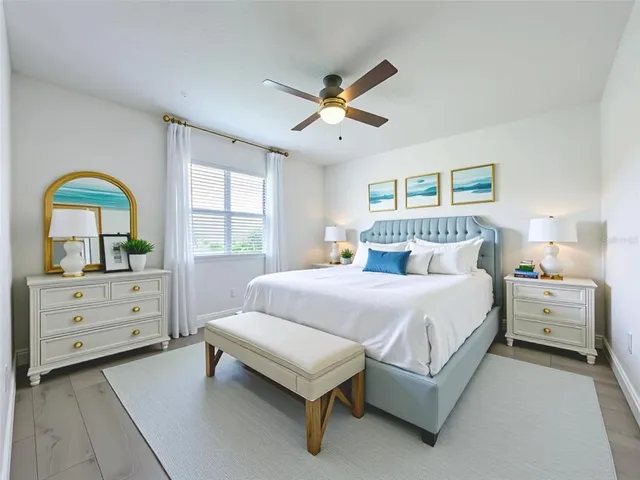 a bedroom with a bed and a window