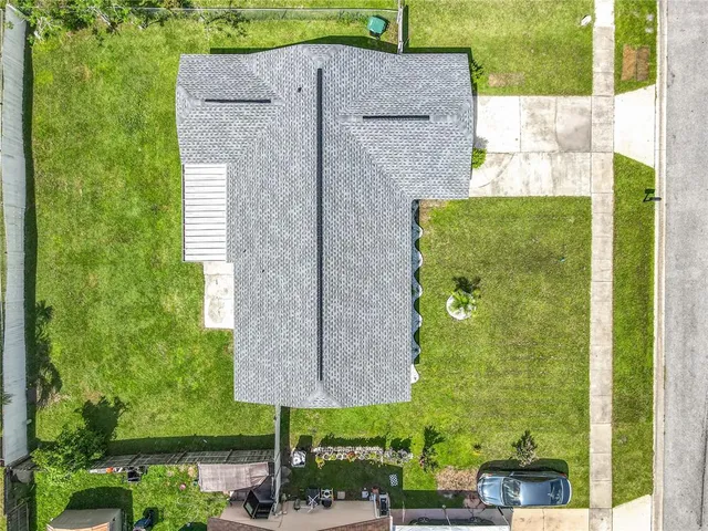 an aerial view of residential houses with outdoor space