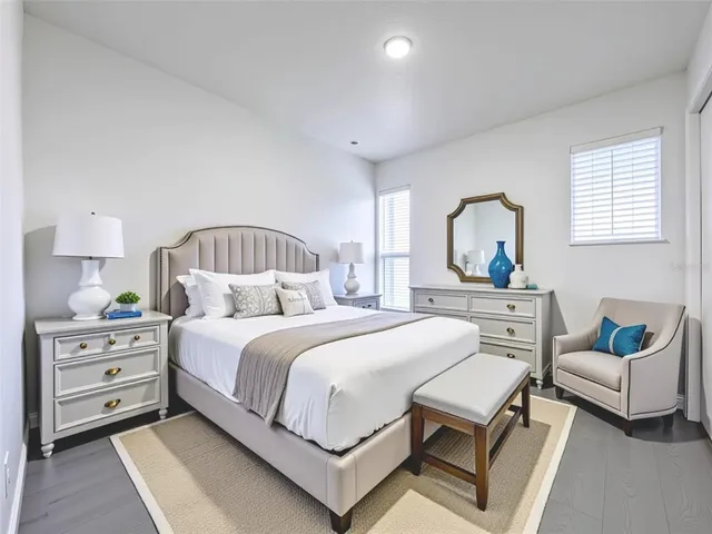 a bedroom with a bed and a dresser