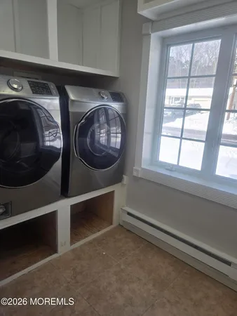 a kitchen with a sink a stove and cabinets