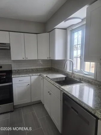 a view of hallway with closet
