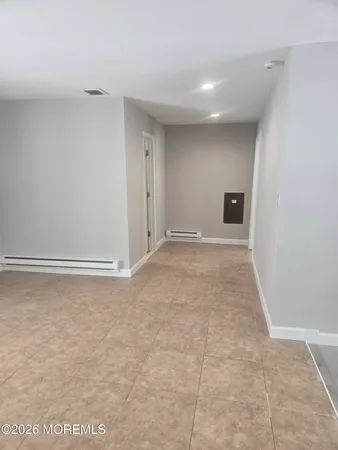 a bathroom with a glass shower door