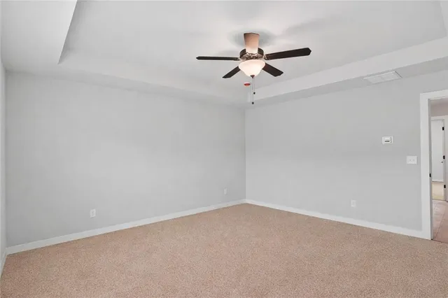 a view of a big room with carpet